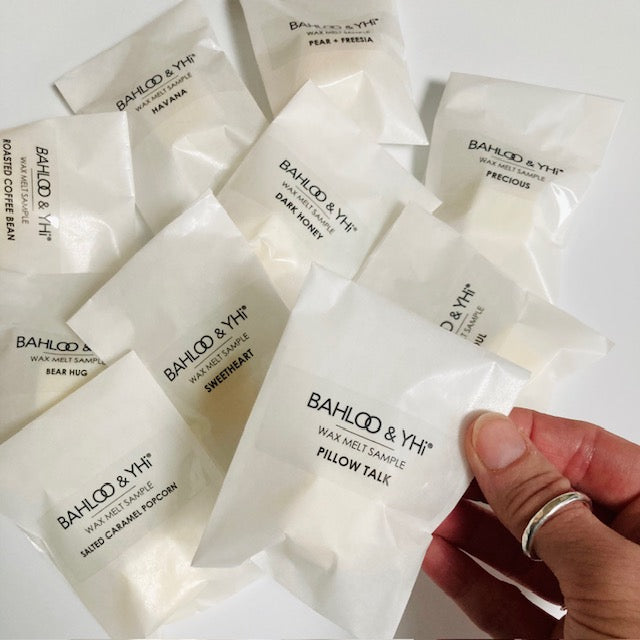 wax melt sample in white paper packaging